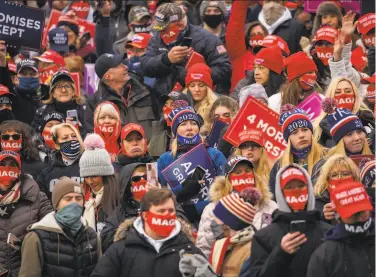  ?? Doug Mills / New York Times 2020 ?? Supporters of former President Donald Trump attend a rally in Waterford Township, Mich., in October.