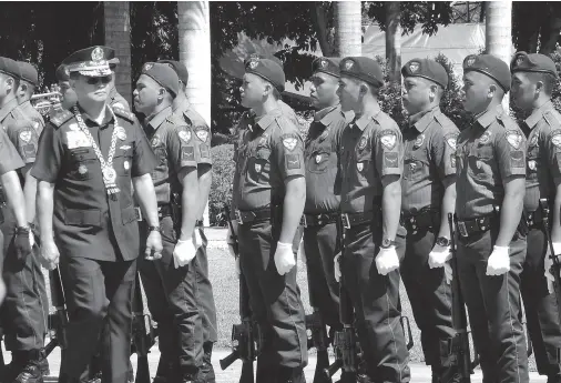  ??  ?? LT. GEN. Archie Francisco Gamboa, the PNP deputy director general, reviews the troops as he graces the 118th Police Service Anniversar­y held in Camp Quintin Merecido on Thursday morning. BING GONZALES