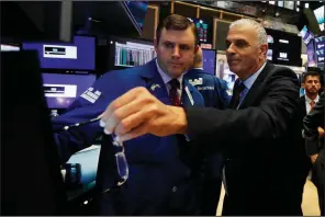  ?? AP/RICHARD DREW ?? Israeli Finance Minister Moshe Kahlon (right) meets with specialist Thomas Schreck during a visit to the New York Stock Exchange trading floor on Monday.