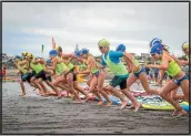  ??  ?? Competitor­s in the Diamond event, a swimming and paddle board race.