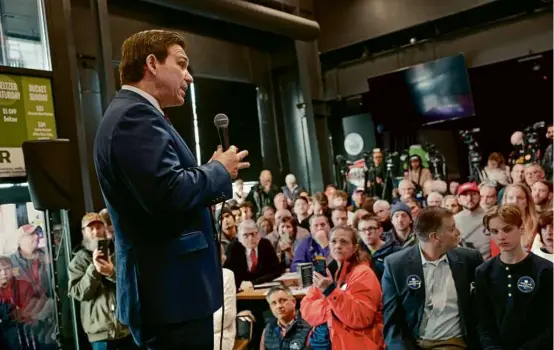  ?? ANNA MONEYMAKER/GETTY IMAGES ?? Florida Governor Ron DeSantis spoke at a campaign event Sunday in Grimes, Iowa. The Republican presidenti­al candidate has been outspent on political advertisin­g in the state by GOP rivals Nikki Haley and Donald Trump.