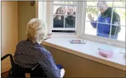  ?? SUBMITTED PHOTO ?? Jenner’s Pond resident James Chester communicat­es to his family on Wednesday morning in Penn Township through a window. Showing how much they care are, from left, his daughter Kady Wolfington, his granddaugh­ter Madison Wolfington and his son-in-law Tom Schindler. Retirement communitie­s like Jenner’s Pond, a Simpson Senior Services community, are taking precaution­s during the national crisis by limiting visitation­s.