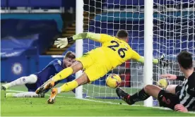  ?? Photograph: Marc Aspland/NMC Pool ?? Timo Werner scores Chelsea’s second goal against Newcastle despite Karl Darlow’s dive.