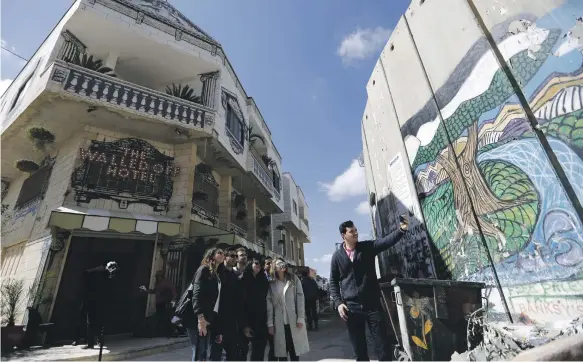  ?? EPA ?? British artist Banksy’s The Walled Off Hotel in Bethlehem has the ‘worst view in the world’ but attracted 50,000 tourists in a year, says Palestine’s tourism minister