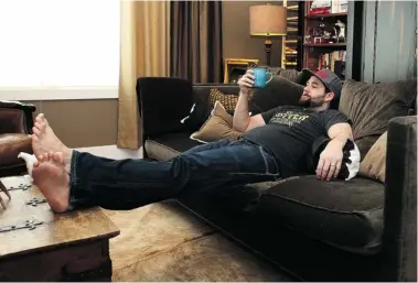  ?? Photos: Wil Andruschak/for the Calgary Herald ?? Cookbook author Pierre Lamielle relaxes with a cup of tea in the living area of his home in Montgomery.