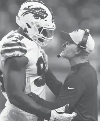  ?? RICK OSENTOSKI/AP ?? Bills DE Efe Obada talks with coach Sean Mcdermott during Friday’s preseason game against the Lions. Odaba, entering his fourth NFL season and first with the Bills, was born in Nigeria and later lived in foster homes in London.