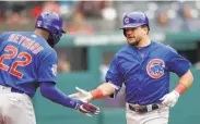  ?? Tony Dejak / Associated Press ?? The Cubs’ Jason Heyward greets Kyle Schwarber after his first home run, in the second inning.