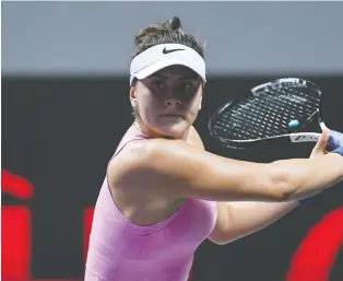  ?? NOEL CELIS/AFP VIA GETTY IMAGES ?? Canada’s Bianca Andreescu hits a return against Simona Halep during the women’s singles first-round match in the WTA Women’s Finals tennis tournament in Shenzhen on Monday.