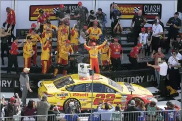  ?? PHELAN M. EBENHACK — THE ASSOCIATED PRESS ?? Joey Logano celebrates in Victory Lane after winning the NASCAR Clash at Daytona on Sunday.