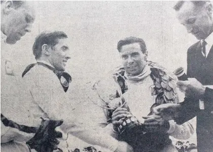  ?? Picture / Levin Chronicle ?? Jackie Stewart (left) rates Jim Clark (with trophy at Levin) as the best he raced against.