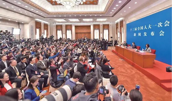  ??  ?? The first session of the 13th National People’s Congress holds a press conference in Beijing yesterday. Spokesman Zhang Yesui talked about a range of issues, including the Belt and Road initiative, China’s developmen­t path and China-US cooperatio­n. —...