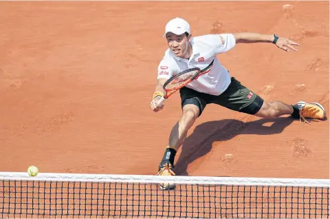  ?? AP ?? Japan’s Kei Nishikori returns the ball to Spain’s Fernando Verdasco in the French Open fourth round on Monday.