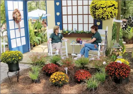  ?? Photo by Hamilton County Master Gardeners ?? Hamilton County Master Gardeners will staff a booth at the Master Your Garden expo today and Sunday, answering questions about gardening. Carol Mathews, left, and Gayle Smith are shown in the Master Gardeners’ booth at last year’s Hamilton County Fair.