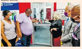  ?? ?? Mayor Mzi Thebolla and US Consul General Anne Linnee cutting the ribbon to officially open the city's podcast and recording studio, accessible for free to anyone living or studying in the city.