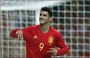  ?? THE ASSOCIATED PRESS ?? FILE - In this file photo, Spain’s Alvaro Morata celebrates scoring his side’s 3rd goal during the World Cup Group G qualifying soccer match between Spain and Italy at the Santiago Bernabeu stadium in Madrid, Spain.