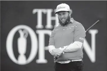  ?? Matthew Lewis Getty Images ?? ANDREW “BEEF” JOHNSTON looks pleased as he stands on the 18th green during the third round of the British Open. He was in fourth place, seven strokes back, heading into the final round.