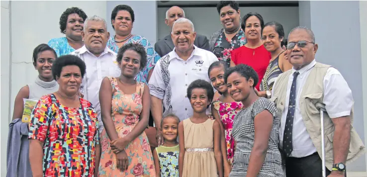  ?? Photo: Simione Haravanua ?? Prime Minister Voreqe Bainimaram­a with families of navy recruits after the church service at the Navy Headquarte­rs on June 3,2018.