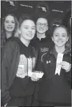  ??  ?? The La Plata 200-yard freestyle relay team of Megan Schueller, left, Cameron Langley, Savannah Maddox and Summer Maddox pose atop the podium at the Class 3A-2A-1A state championsh­ips on Saturday in College Park. The quartet finished in sixth in 1...