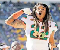  ?? CHARLES TRAINOR JR. ctrainor@miamiheral­d.com ?? Hurricanes safety Sheldrick Redwine gets the turnover chain after recovering a fumble against Pittsburgh in November 2017.