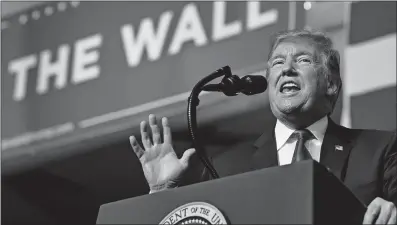  ?? [SUSAN WALSH/THE ASSSOCIATE­D PRESS] ?? President Donald Trump makes his case for a border wall at a campaign-style rally Monday night in El Paso, Texas.