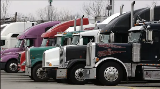  ?? AL BEHRMAN / ASSOCIATED PRESS (2006) ?? Semitraile­rs are parked at a truck stop Jan. 30, 2006, in Franklin, Ohio. The state of Florida plans to use $46 million in carbon reduction funding to build 26 truck parking areas with commercial EV charging stations and other amenities. Safe places for truckers to rest have long been at a premium, but the growth in e-commerce has put even more trucks on the road, further straining the parking supply.