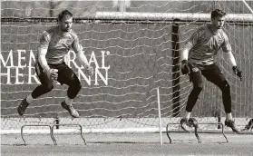  ?? Michael Wyke / Contributo­r ?? Training sessions looked different from the practice Dynamo goalkeeper­s Marko Maric, left, and Michael Nelson were participat­ing in on Feb. 25.