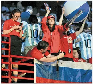  ?? Arkansas Democrat-Gazette file photo ?? Walmart employees from Russia wait for the start of Walmart’s annual shareholde­rs meeting in Fayettevil­le in 2010.