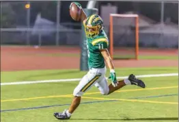  ?? Cory Rubin/The Signal ?? Canyon running back Ryan Valdes raises the ball in celebratio­n of a touchdown against Royal of Simi Valley at Canyon on Friday. Canyon won 48-21.