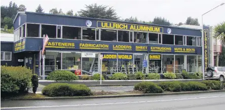  ??  ?? Left: The Ullrich Aluminium Dunedin showroom and factory at 391 Kaikorai Valley Rd.Right: Ullrich Dunedin operations manager Derek Partridge with some of the company’s cladding options.