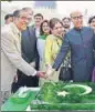  ?? PT ?? Pakistan high commission­er Abdul Basit and wife Summiya cut a cake on Pakistan Day in New Delhi on Thursday.