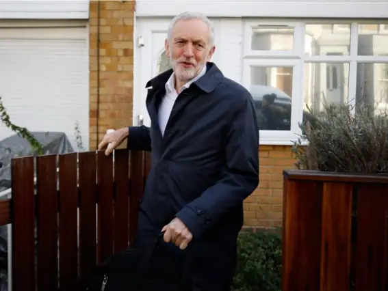  ??  ?? Jez you wait: the Labour leader leaving his house for PMQs yesterday (AFP/Getty)