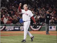  ?? Winslow Townson / Associated Press ?? Red Sox pitcher Curt Schilling tips his hat as he walks off the field after being taken out of Game 2 of the 2007 World Series against the Rockies at Fenway Park.