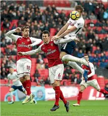  ?? PHOTOS: GETTY IMAGES ?? Harry Kane heads home Tottenham Hotspur’s winner in a London derby win over Arsenal.