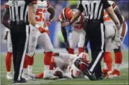  ?? PAUL SANCYA — ASSOCIATED PRESS ?? Jamie Collins grabs his knee after being injured against the Lions on Nov. 12 in Detroit.