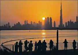  ?? Kamran Jebreili Associated Press ?? THE BURJ Khalifa skyscraper rules the sunset in Dubai, United Arab Emirates, which has eased Islamic personal laws ahead of an expected inf lux of tourists.