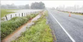  ?? PHOTOS: WARREN BUCKLAND. ?? Water was across SH2 in a number of places, including near Pukehou and Poukawa.