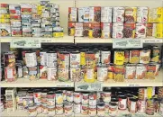  ?? JOHN RENNISON THE HAMILTON SPECTATOR ?? Shelves of canned goods at a local food bank. Dr. Raza Khan writes: “... the sad reality is the bounties that this world offers have not been equally distribute­d both here at home and across the globe.”