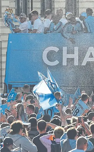  ?? OLI SCARFF/AFP/GETTY IMAGES ?? Manchester City held a championsh­ip parade on Monday after a season where it became the first Premier League team to tally 100 points in a season and had a record winning margin of 19 points.