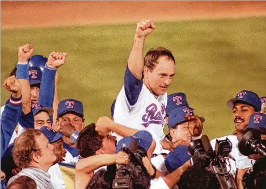  ?? BILL JANSCHA/AP 1991 ?? Rangers teammates carry Nolan Ryan off the field on May 1, 1991, after his seventh no-hitter, this one against the Toronto Blue Jays in Arlington, Texas. A new documentar­y delves into the career, the stats and the family life of the legendary Hall of Fame pitcher.