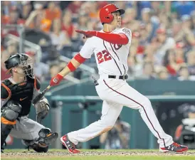  ??  ?? The Nationals’ Juan Soto follows through on a two-run double.