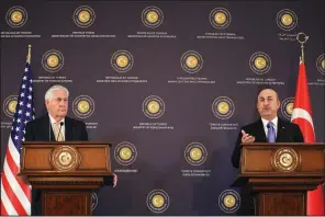  ?? AP/BURHAN OZBILICI ?? Turkish Foreign Minister Mevlut Cavusoglu (right) and U.S. Secretary of State Rex Tillerson hold a news conference Friday in Ankara, where both men said a “crisis” had been turned aside.
