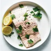  ?? YORK TIMES DAVID MALOSH / THE NEW ?? This perfectly seasoned salmon cooks quickly in the microwave and can be enjoyed on its own or used in salads, grain bowls or other dishes.