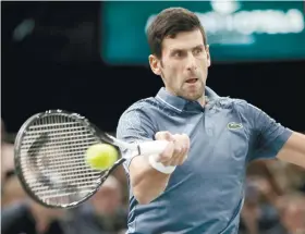  ?? AP FOTO ?? NO. 5 Novak Djokovic of Serbia defeated Marin Cilic in three sets to set up a semifinal clash with Roger Federer.