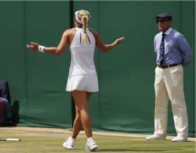  ??  ?? WHAT’S GOING ON? Germany’s Angelique Kerber reacts after missing a shot against Spain’s Garbine Muguruza.