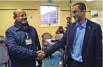  ?? -Essa Ahmed/Yemen Peace Consultati­ons Newsroom/AFP ?? WARM GREETINGS: Houthi representa­tive Salim Al Moughaless, right, and Yemeni economist and government representa­tive Ahmed Ghaleb shake hands during the first Yemen peace talks since 2016, on December 10, 2018 in the Swedish rural town of Rimbo.