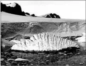 ?? ANDREW SHEPHERD/UNIVERSITY OF LEEDS ?? An iceberg is seen near an Antarctic research station. Antarctica alone could add about half a foot to sea level rise by the end of the century, one researcher said.