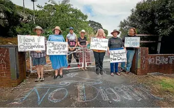  ?? PHOTOS: BRODY DOLAN/ STUFF ?? A group of peaceful protesters gathered at the gates of New Plymouth’s Maungaroa to mark the one-year anniversar­y of its sale.