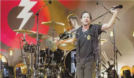  ?? TNS PHOTO ?? HOME TOWN HEROES: Matt Cameron, left, and Eddie Vedder of Pearl Jam perform during last year’s Bonnaroo Music and Arts Festival in Manchester, Tenn. Despite their fame and success, the band stil calls Seattle home.
