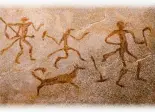  ??  ?? An ancient depiction of hunters with a dog on the wall of the cave