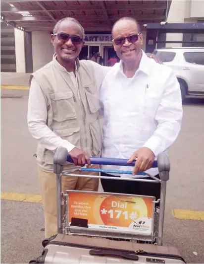  ??  ?? The author (left) at departure gate of Harare Internatio­nal Airport with old friend, Professor Chakanyuka Karase